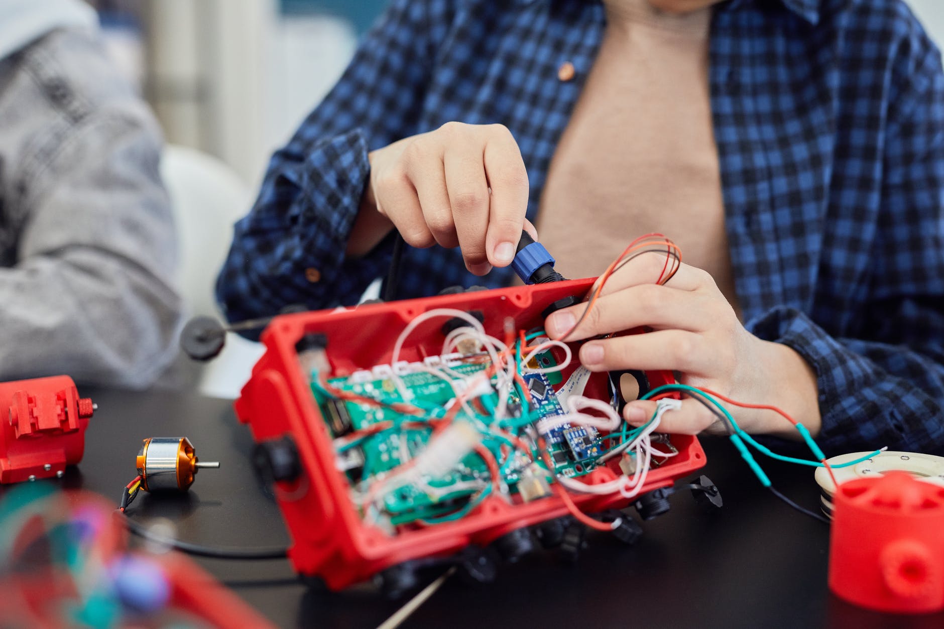 a person fixing electronics